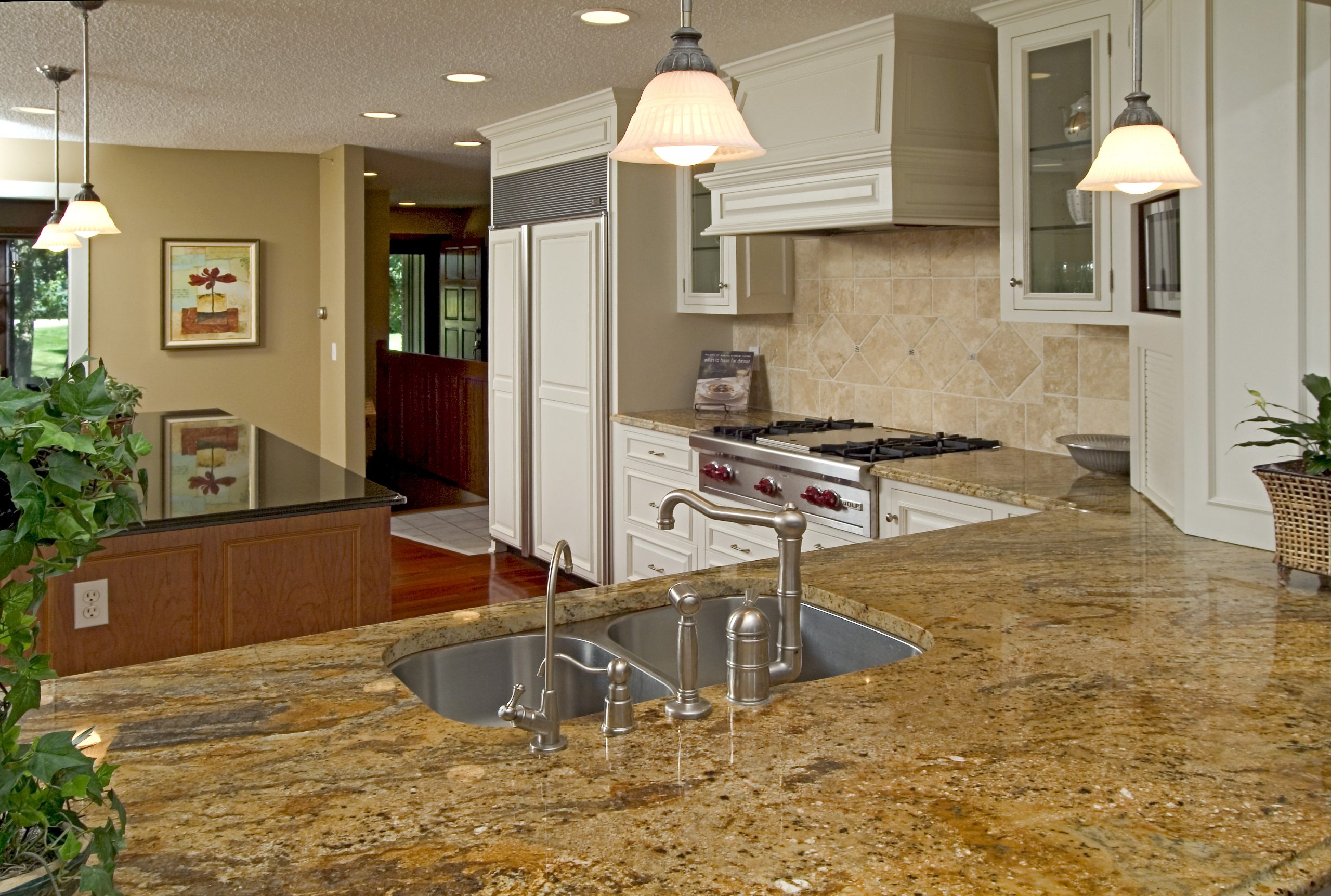 White cabinets with alternate color center island